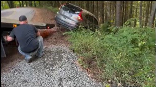 Josh Keller performing vehicle recovery in Oregon forest